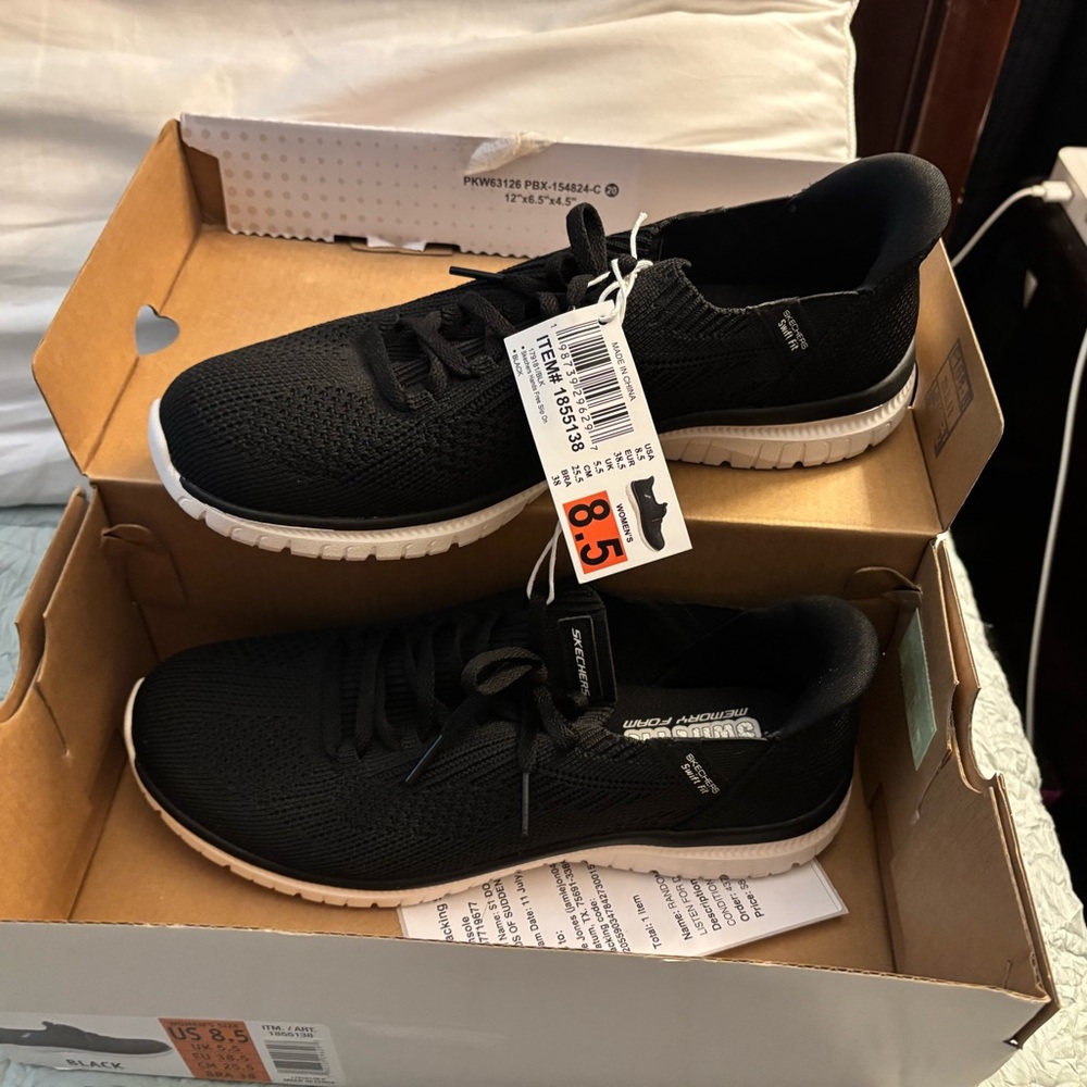 Skechers women’s Black and White Sneakers